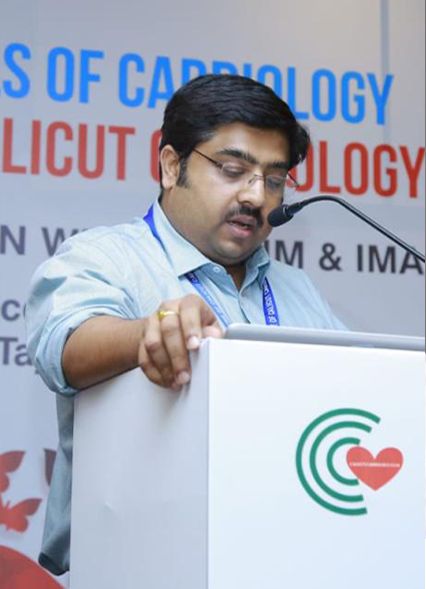 Dr. Harikrishna D speaking at a cardiology conference in Calicut